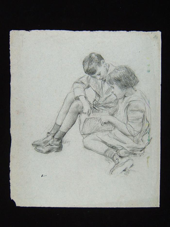 Duas crianças lendo um livro